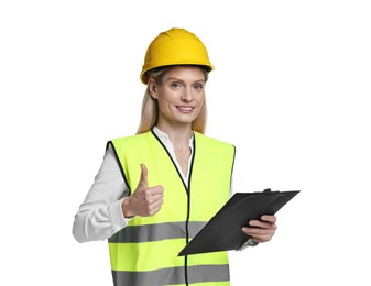 Engineer in hard hat holding clipboard and showing thumb up on white background