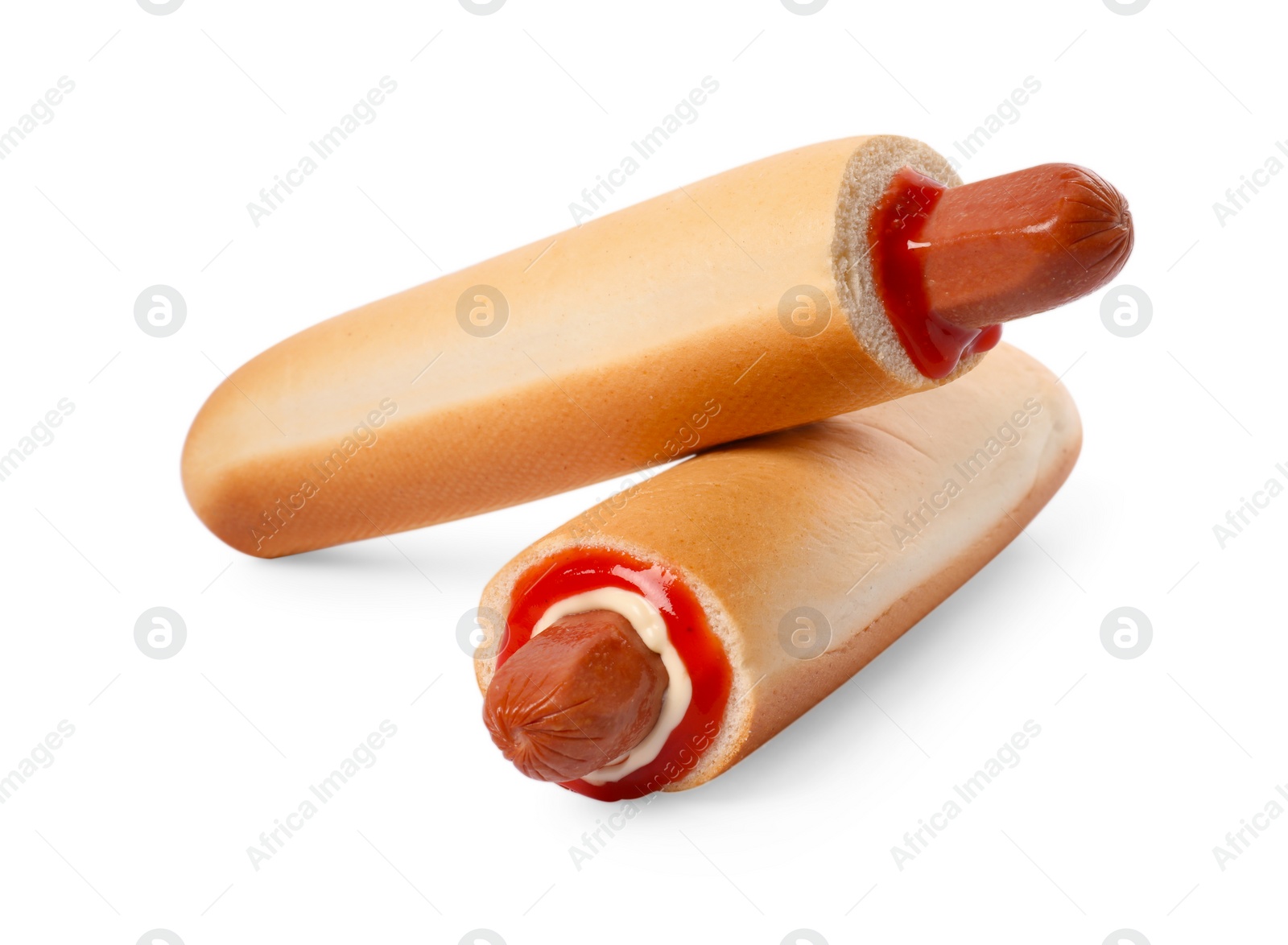 Photo of Tasty french hot dogs with sauce isolated on white