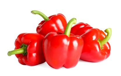 Tasty ripe red bell peppers on white background