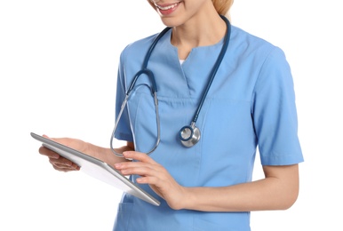 Photo of Medical doctor with stethoscope using tablet isolated on white, closeup
