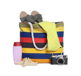 Photo of Stylish bag, camera and other beach accessories isolated on white