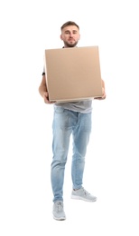 Full length portrait of young man carrying carton box on white background. Posture concept