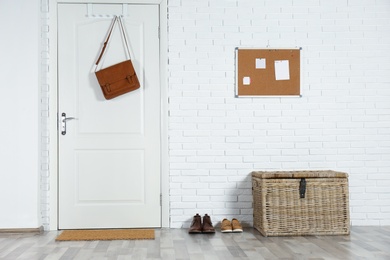 Photo of Hallway interior with white door and mat