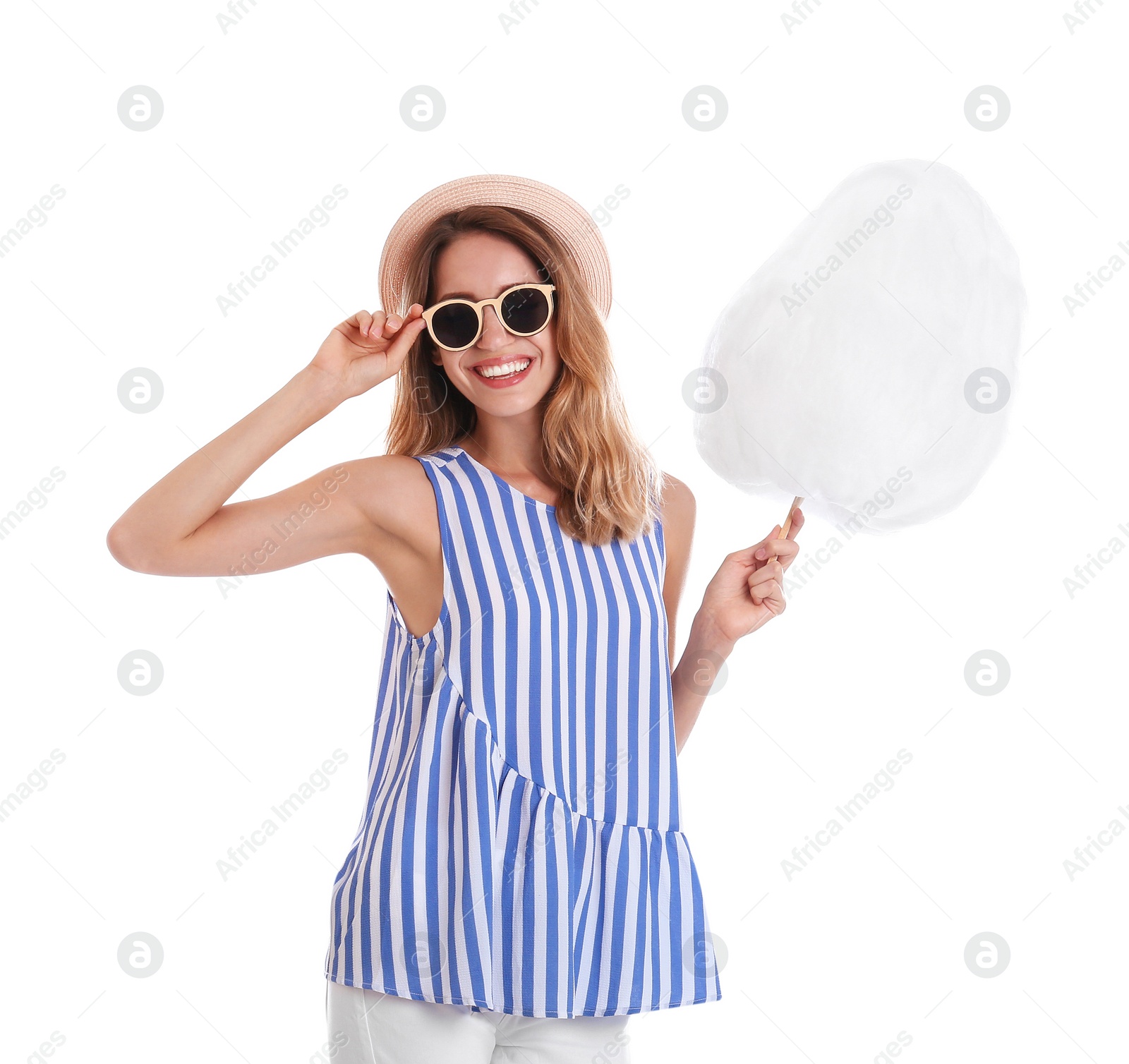 Photo of Happy young woman with cotton candy on white background