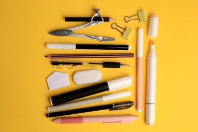 Flat lay composition with different school stationery on orange background. Back to school