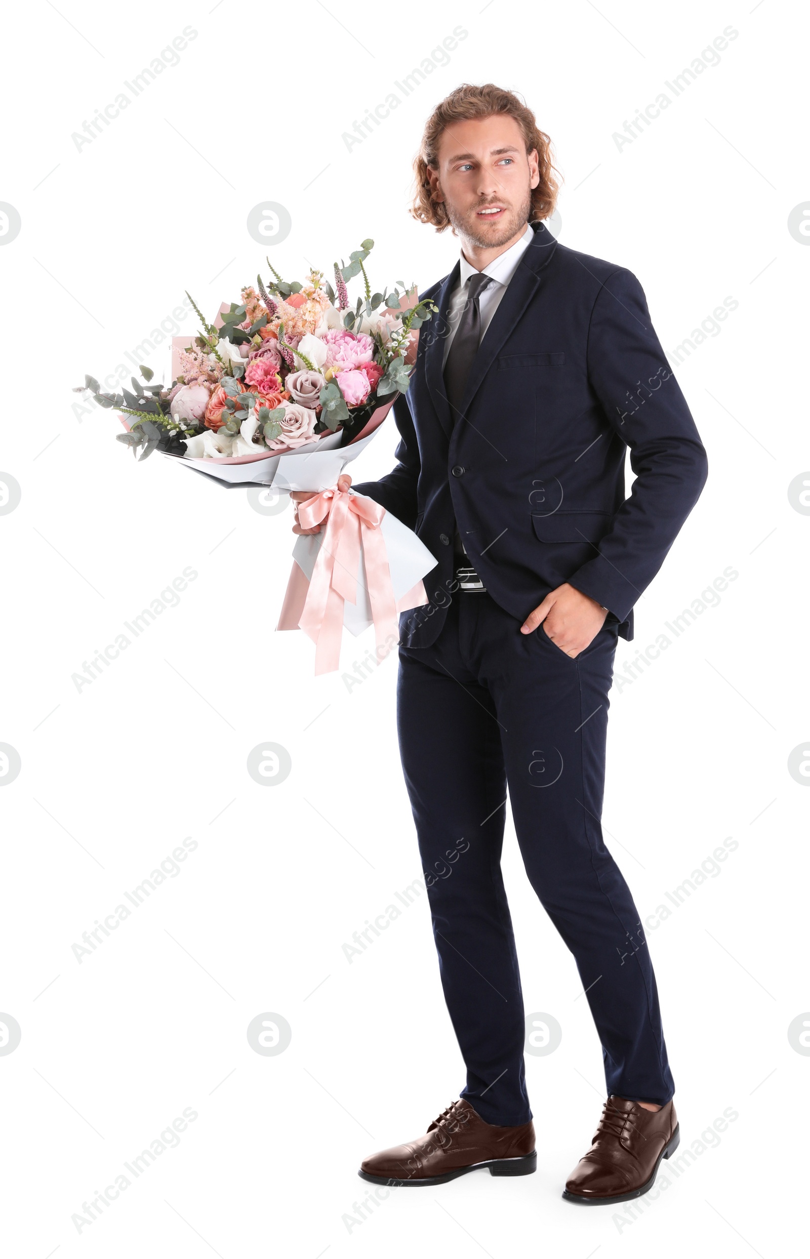 Photo of Young handsome man in stylish suit with beautiful flower bouquet on white background