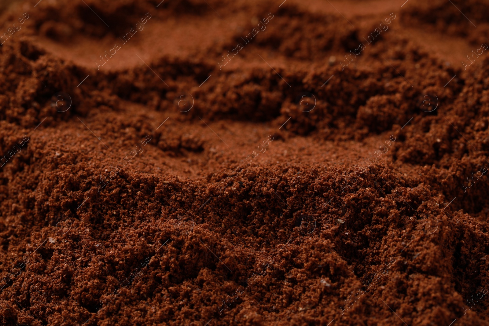 Photo of Dry ground coffee as background, closeup view