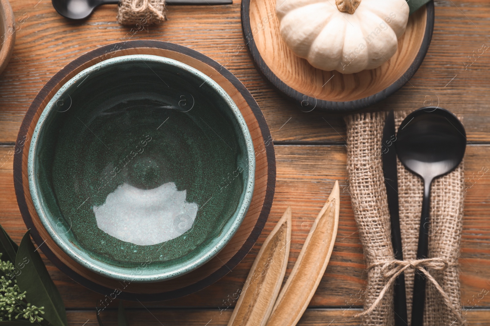 Photo of Autumn table setting with pumpkin and decor on wooden background, flat lay