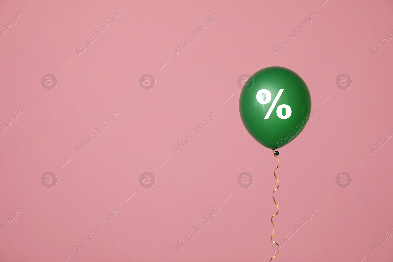 Image of Discount offer. Green balloon with percent sign on pink background, space for text