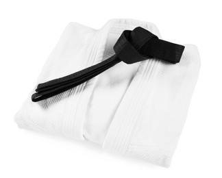 Photo of Black karate belt and kimono isolated on white