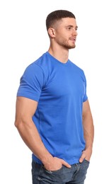 Man wearing blue t-shirt on white background. Mockup for design