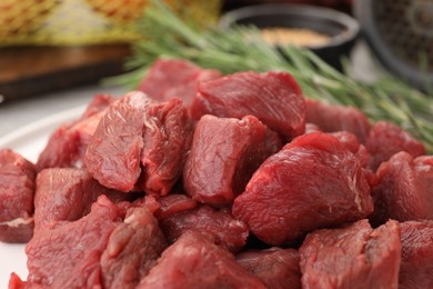 Raw pieces of beef meat on table, closeup