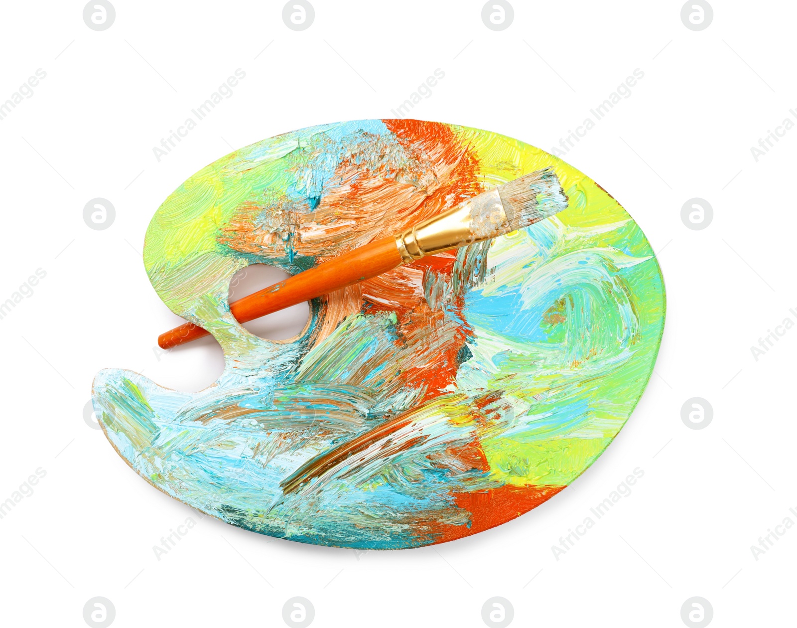 Photo of Artist's palette with mixed paints and brush isolated on white, top view