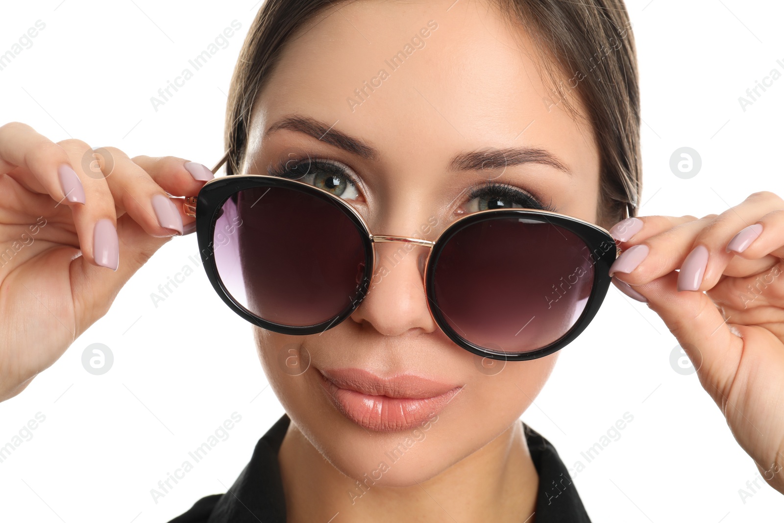 Photo of Beautiful young woman wearing sunglasses on white background, closeup