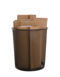 Trash bin full of cardboard on white background. Recycling rubbish