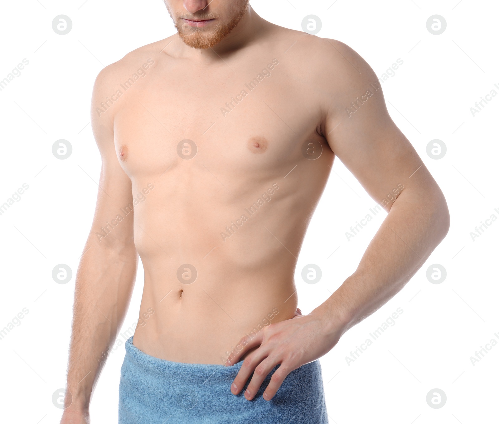 Photo of Young man with slim body in towel on white background, closeup