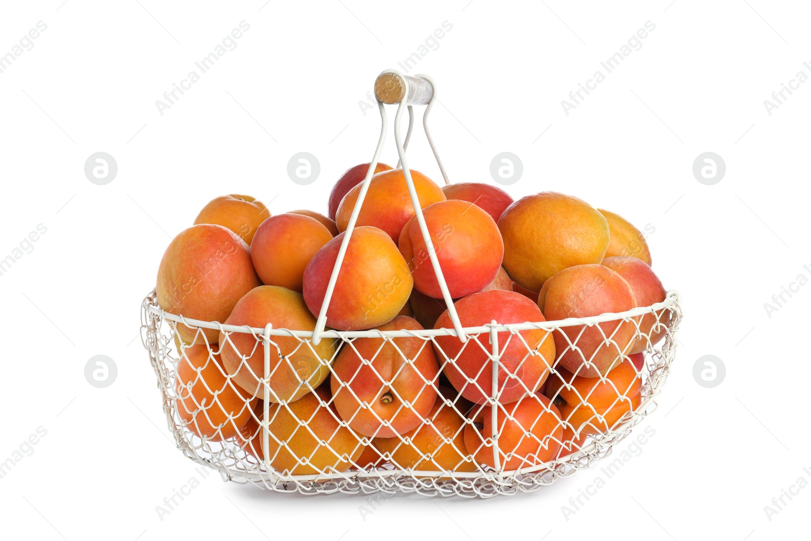 Photo of Delicious ripe apricots in metal basket isolated on white