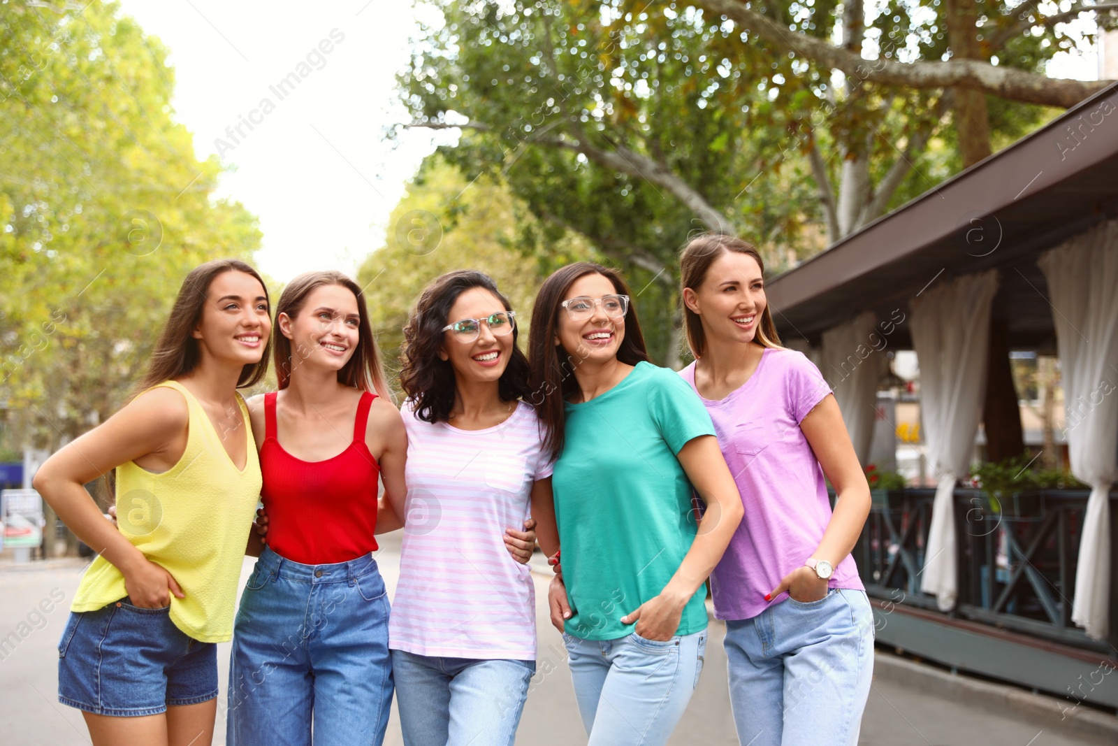 Photo of Happy women outdoors on sunny day. Girl power concept