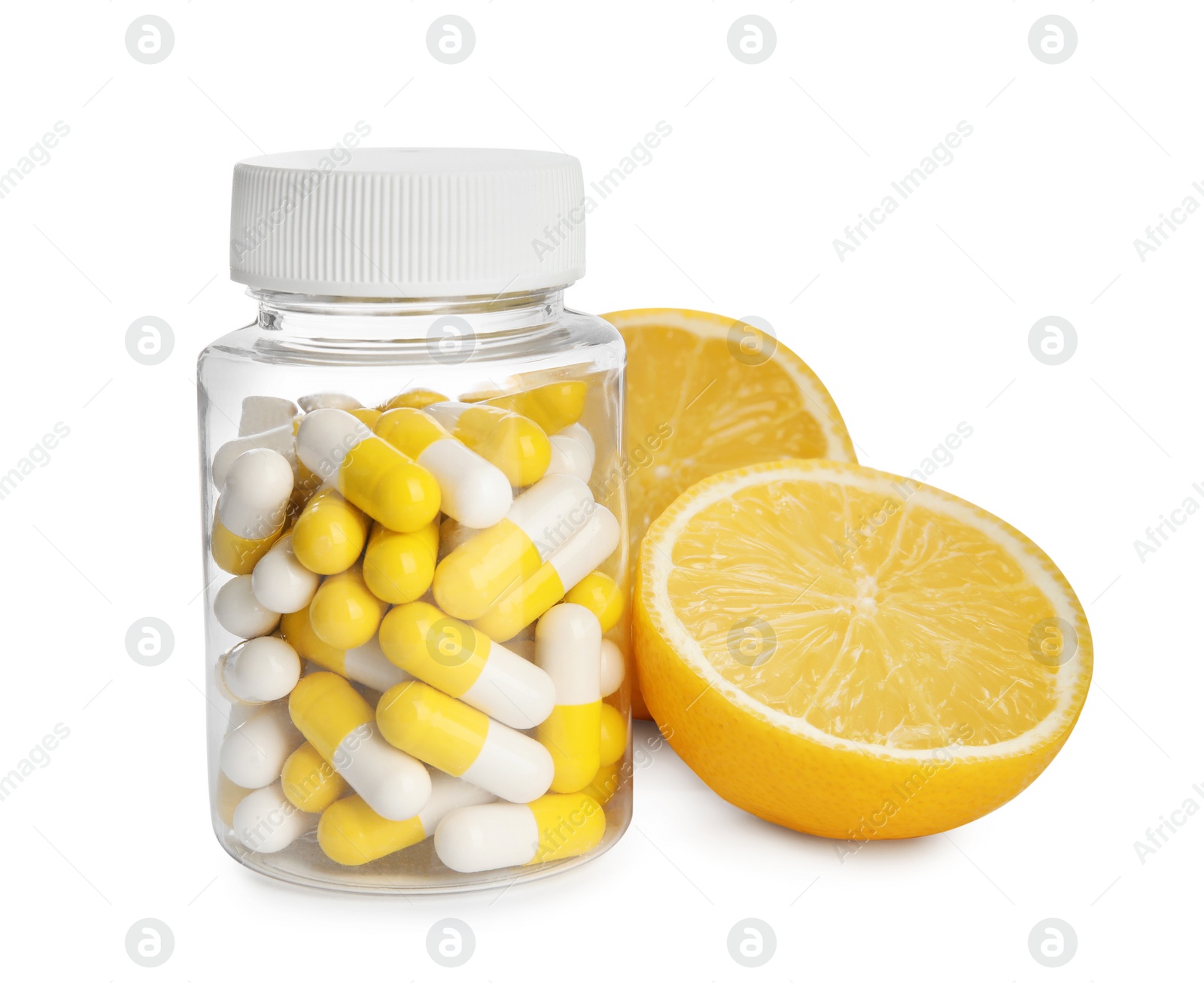 Photo of Bottle with vitamin pills and lemon on white background