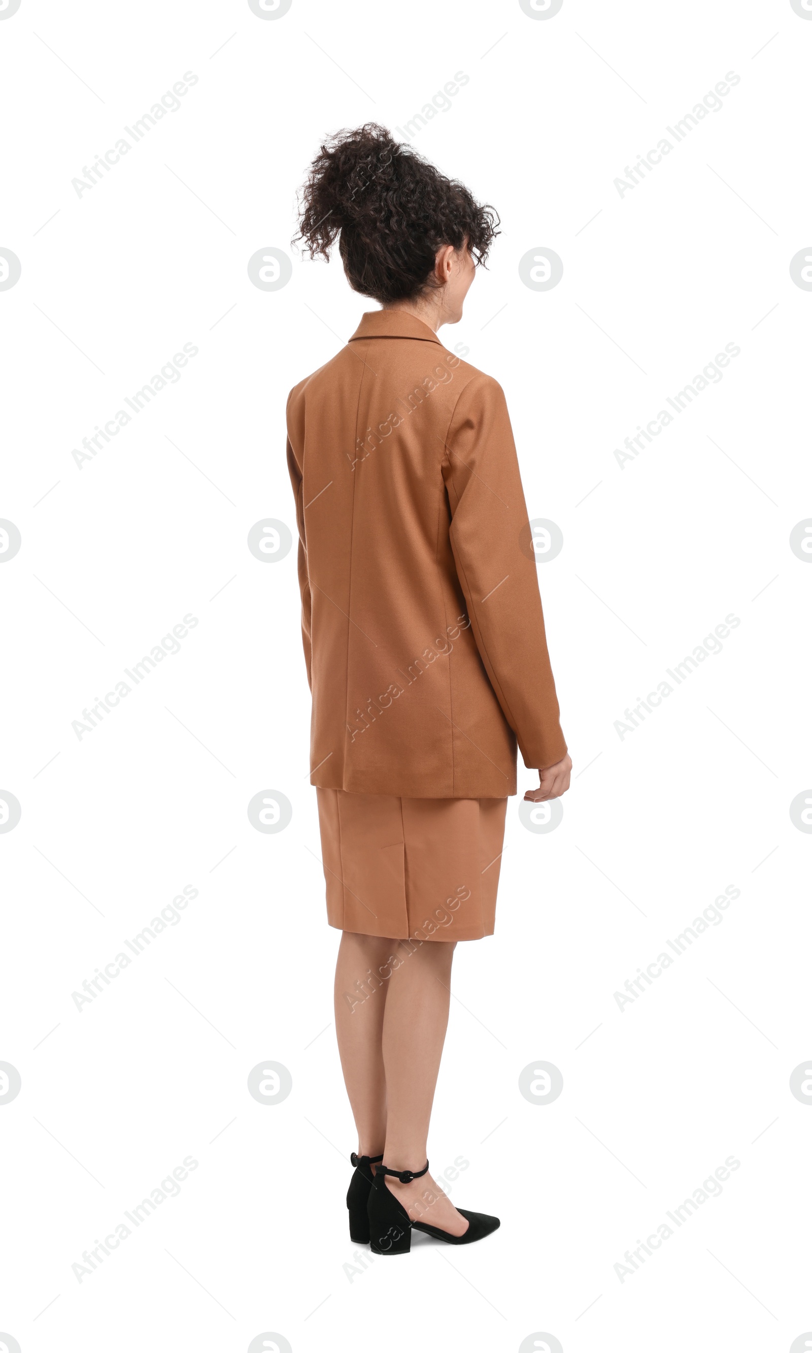 Photo of Young businesswoman in suit standing on white background