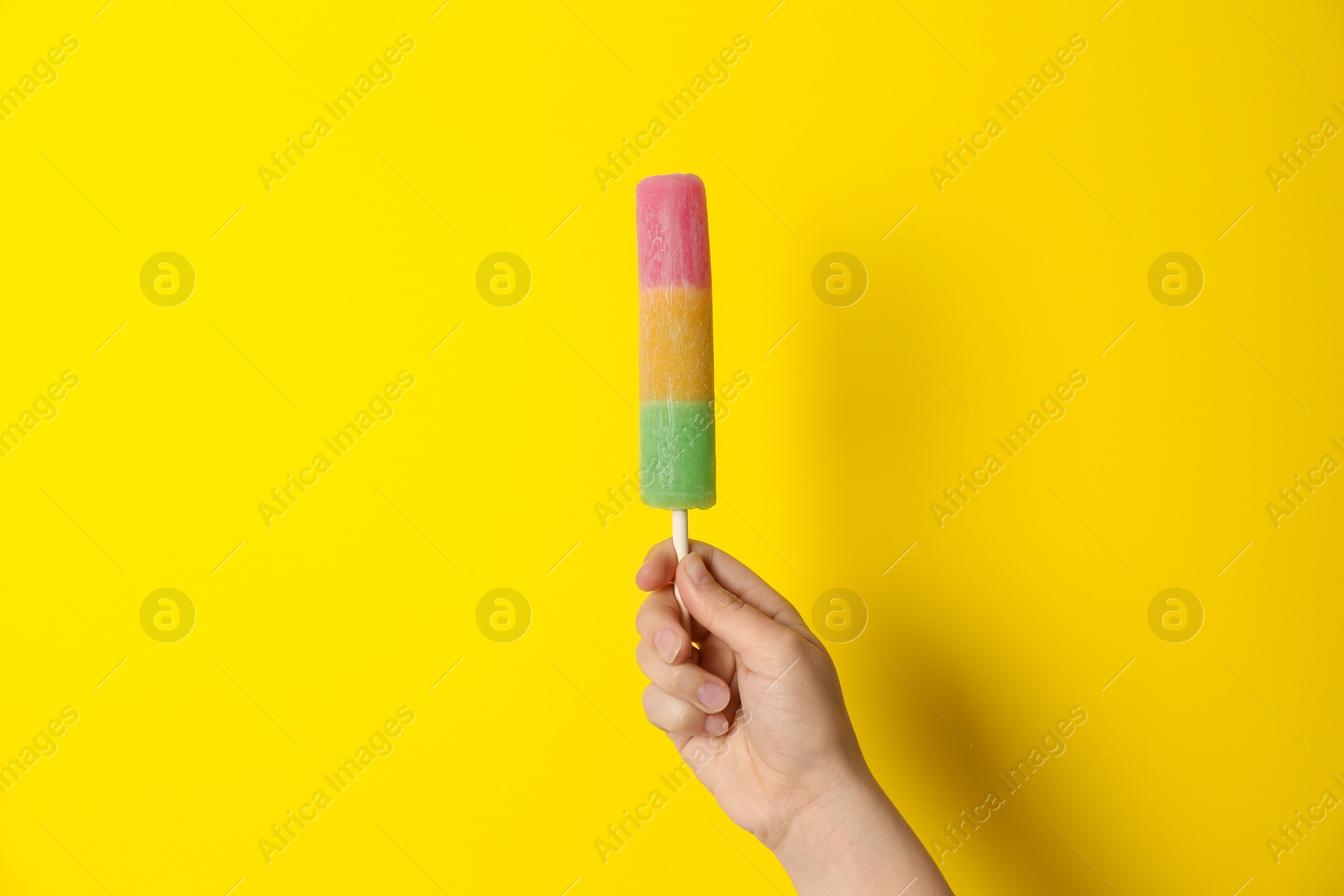 Photo of Woman holding delicious ice cream against color background