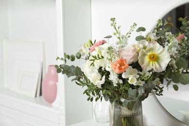 Photo of Bouquet of beautiful flowers in vase indoors, closeup. Space for text