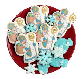 Tasty gingerbread cookies on white background, top view. St. Nicholas Day celebration