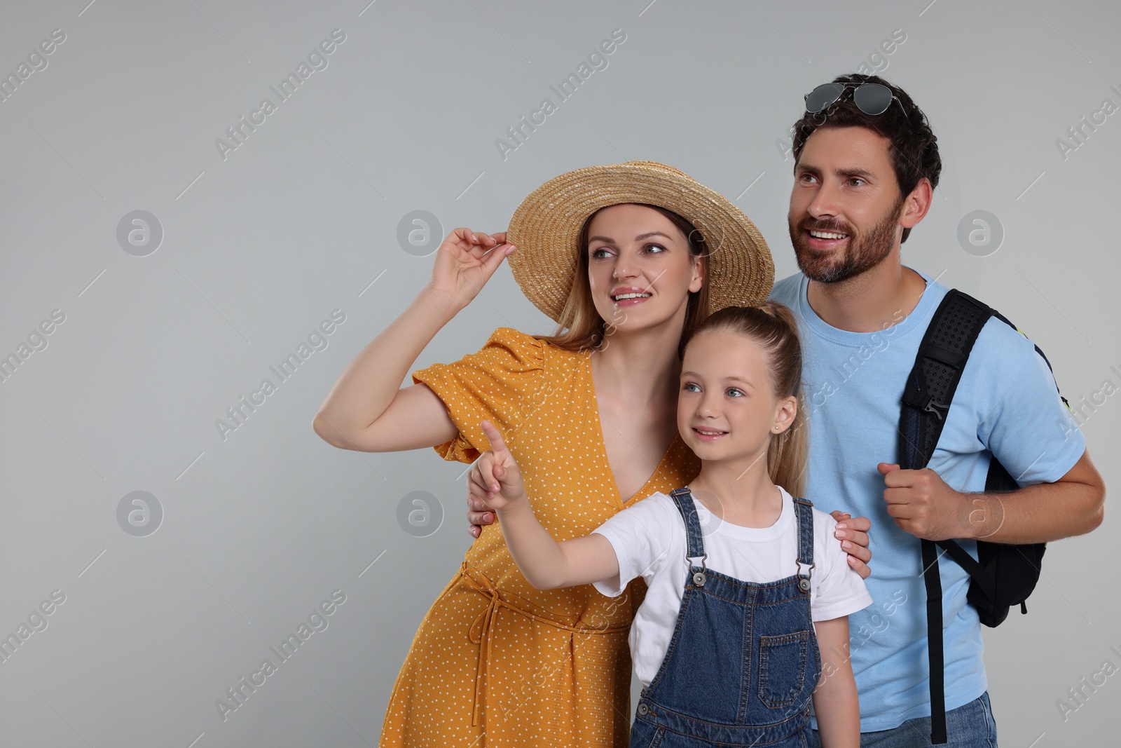 Photo of Happy family on light grey background, space for text