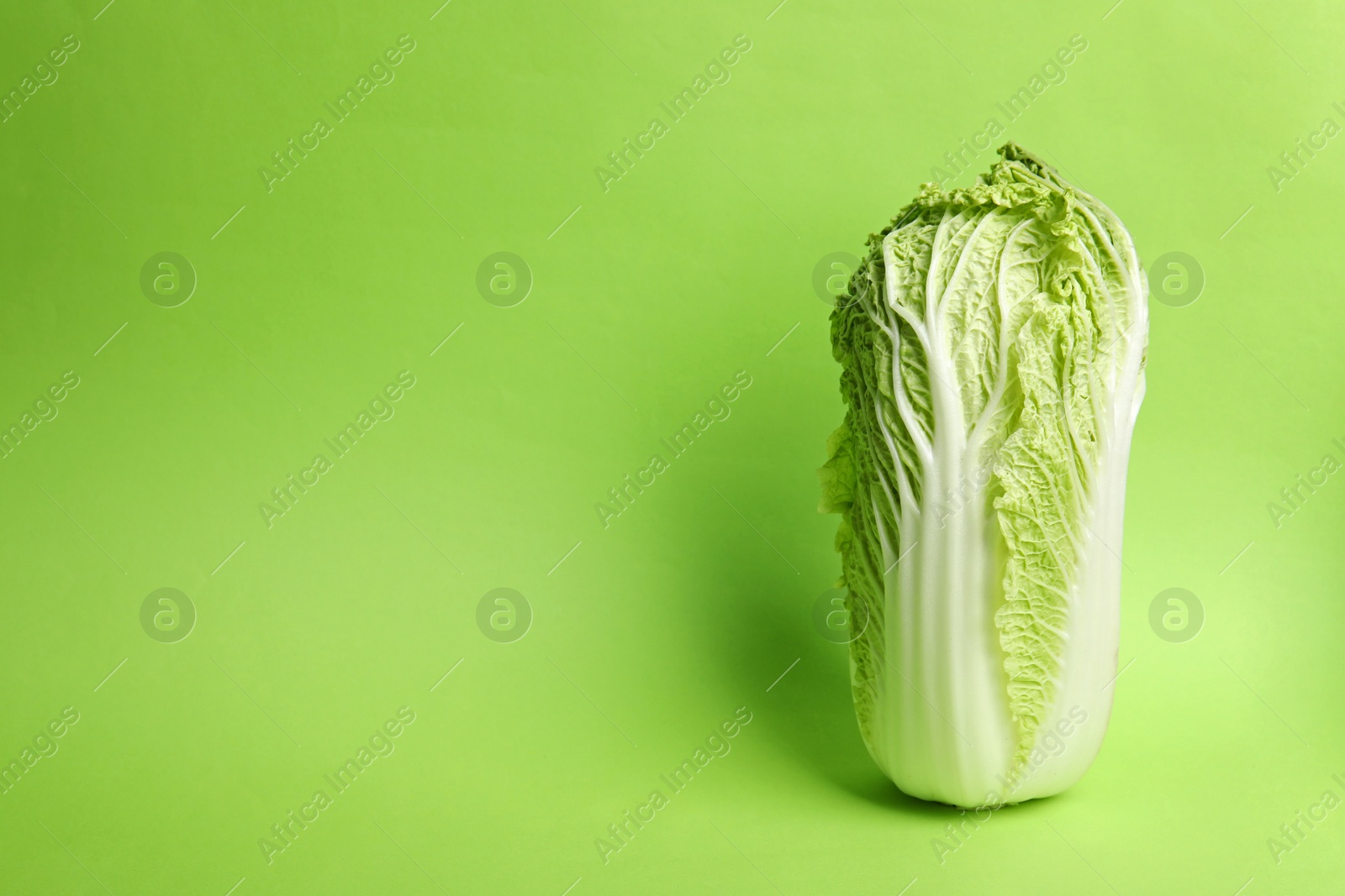 Photo of Fresh ripe cabbage on color background