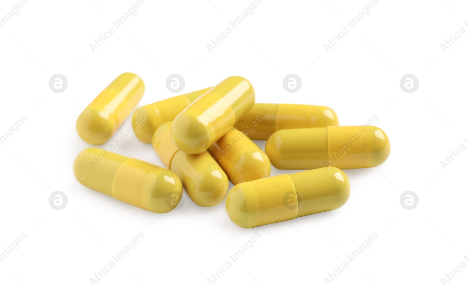 Photo of Many yellow pills isolated on white. Medicinal treatment