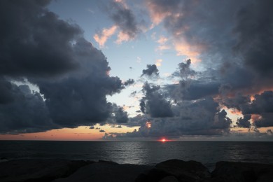 Photo of Picturesque view of sky with heavy rainy clouds over sea