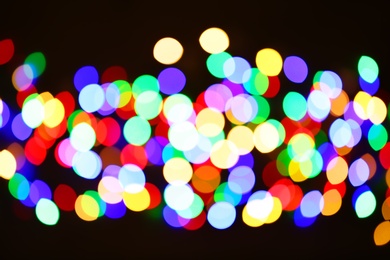 Beautiful colorful lights on dark background. Bokeh effect