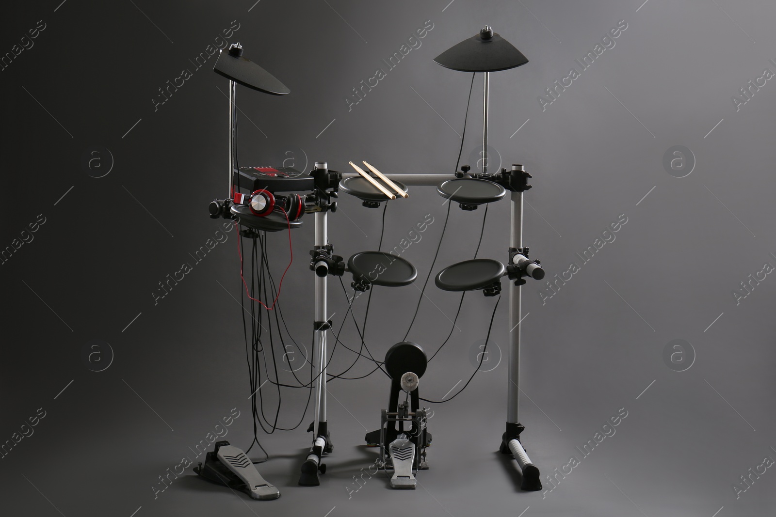 Photo of Modern electronic drum kit on grey background. Musical instrument