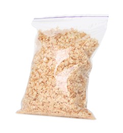 Natural sawdust in zip bag isolated on white