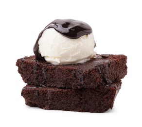 Photo of Delicious brownies with ice cream and chocolate sauce isolated on white