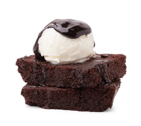 Delicious brownies with ice cream and chocolate sauce isolated on white