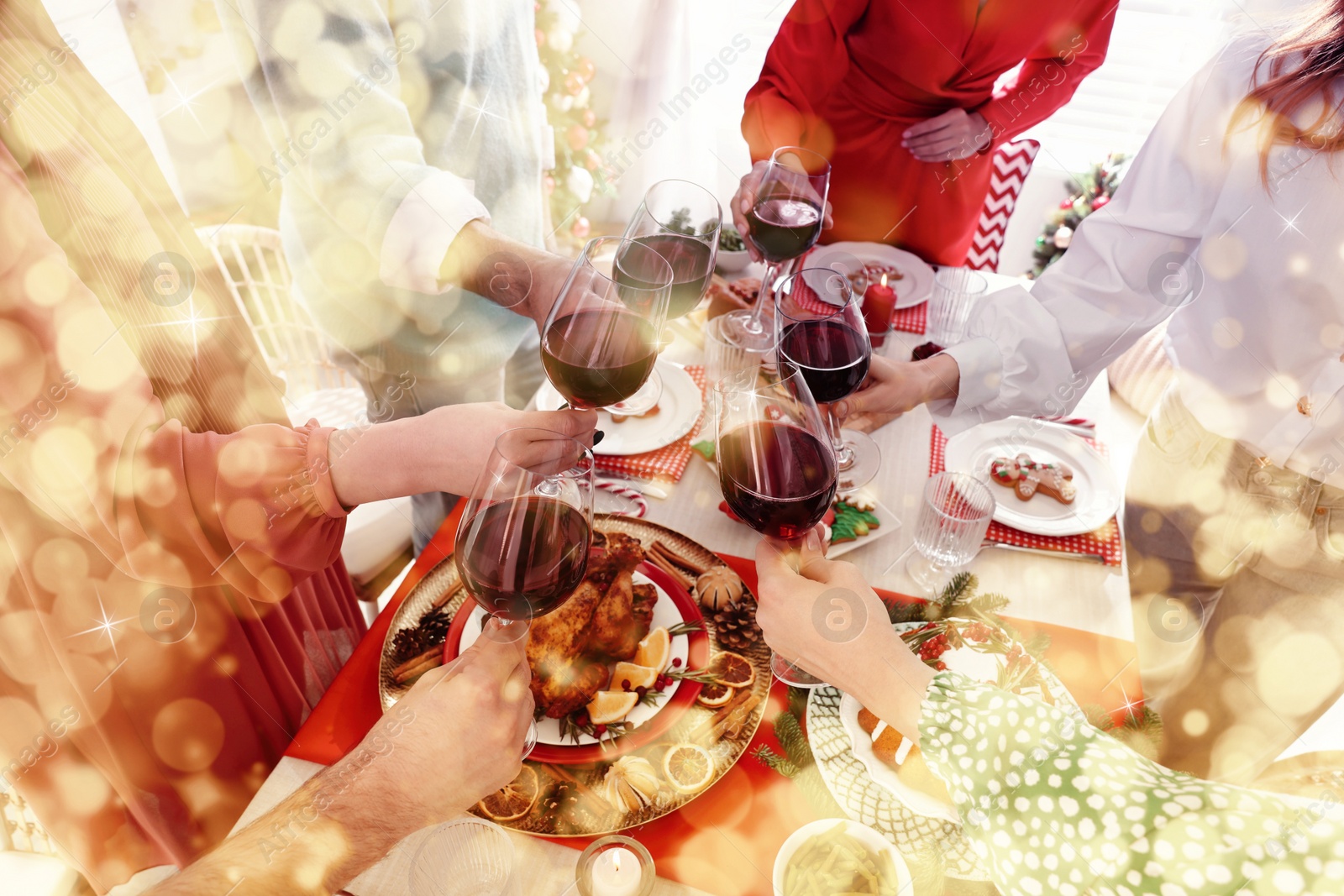 Image of Family with their friends clinking glasses at festive dinner indoors, closeup. Christmas Eve celebration