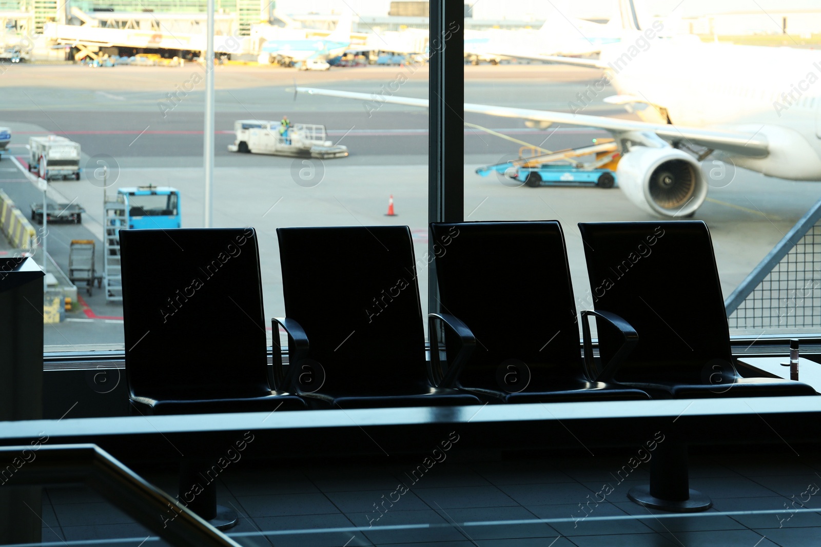 Photo of Row of seats in waiting area at airport terminal