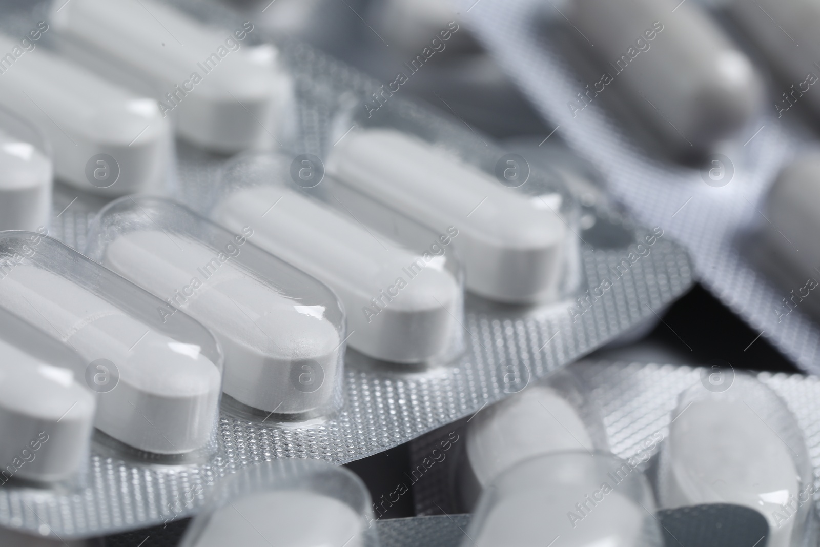 Photo of Many different pills in blisters, closeup view