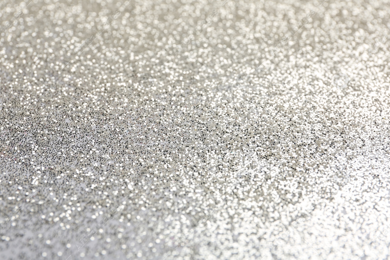 Photo of Closeup view of sparkling silver glitter background