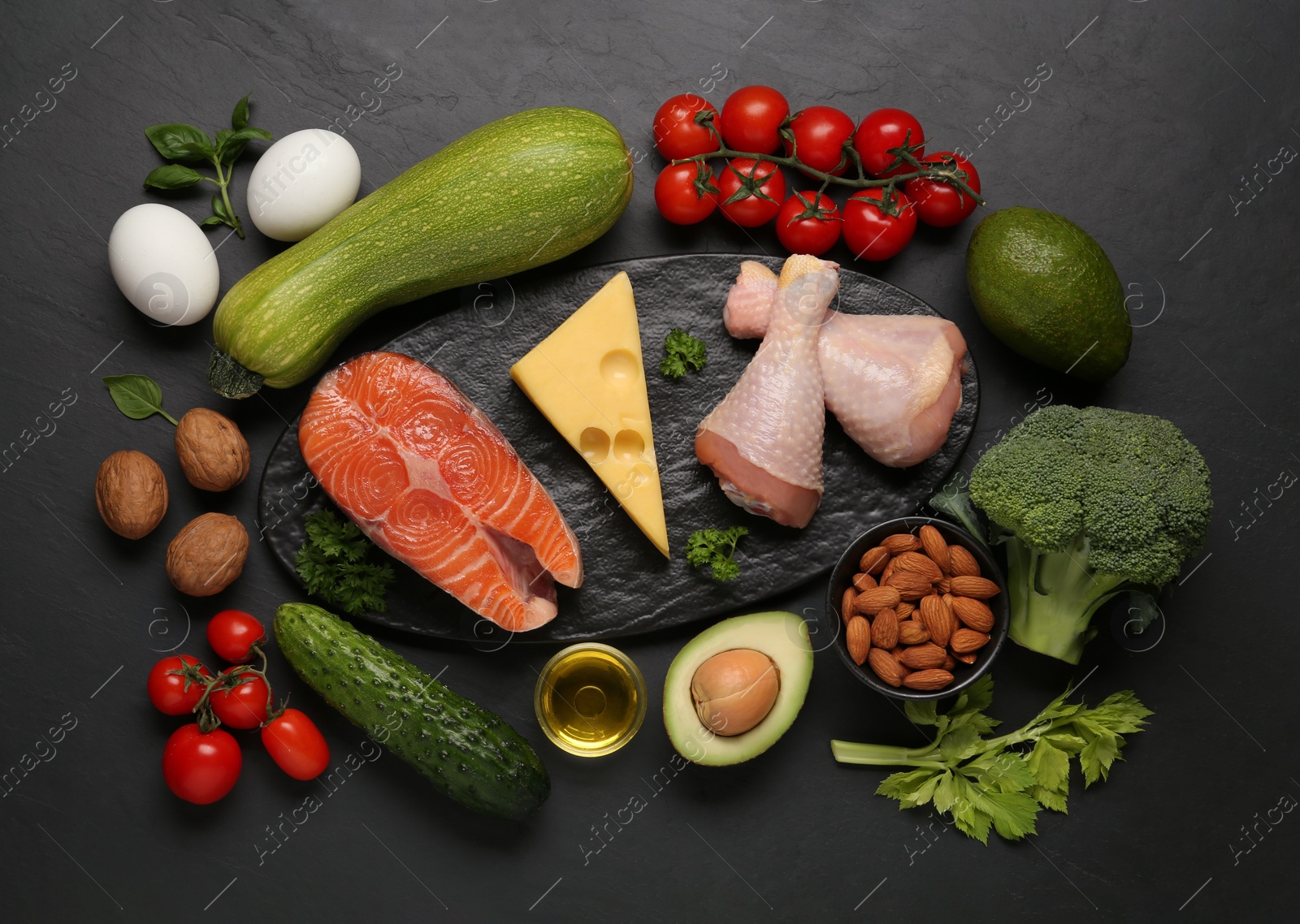 Photo of Flat lay composition with keto diet products on black table