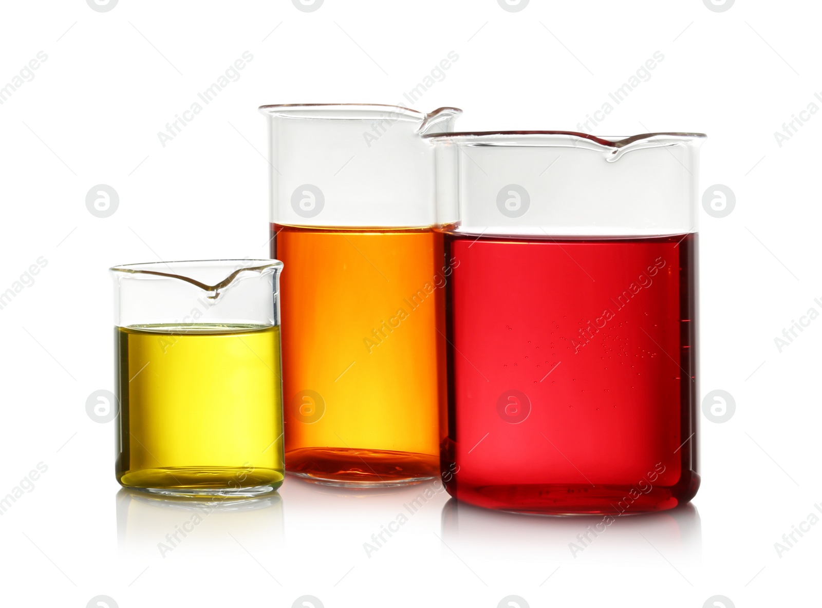 Photo of Beakers with color liquid isolated on white. Solution chemistry