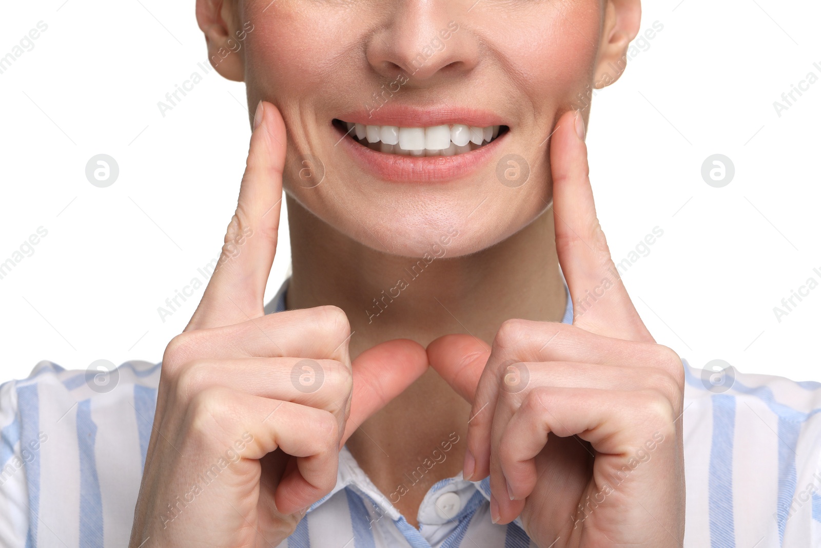 Photo of Woman showing her clean teeth and smiling on white background, closeup