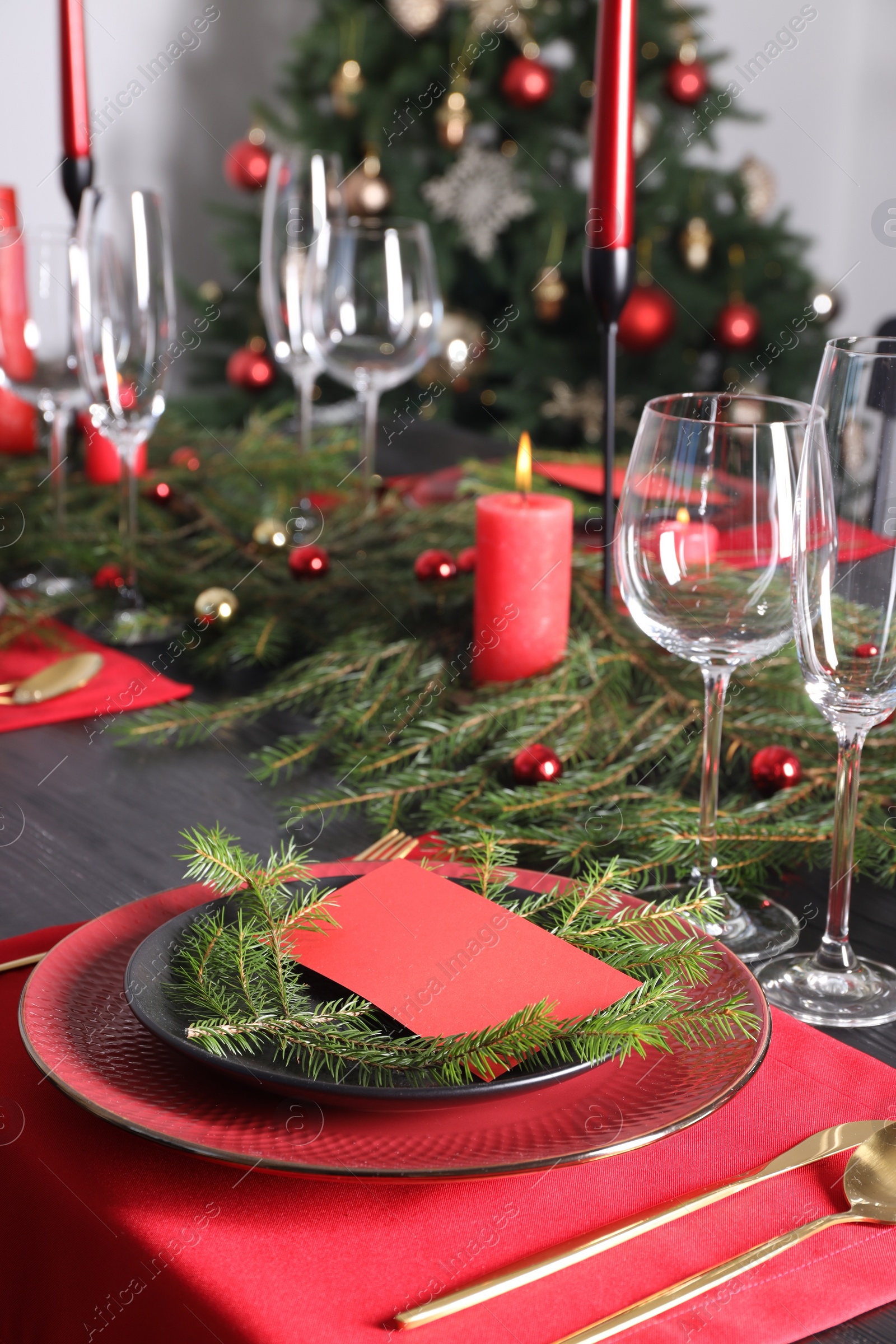 Photo of Elegant Christmas table setting with blank place card and festive decor