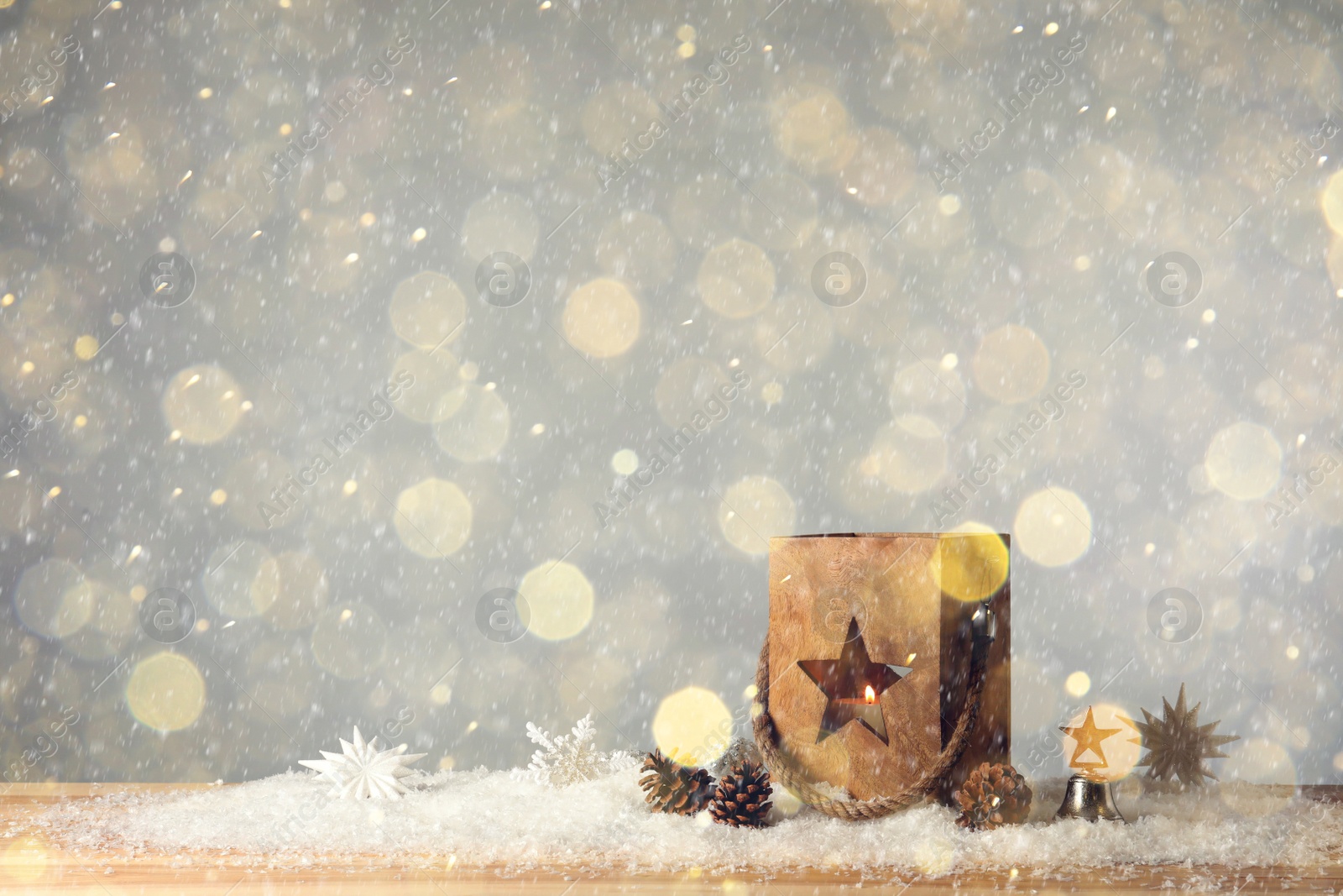 Image of Composition with wooden Christmas lantern on snow, space for text. Bokeh effect