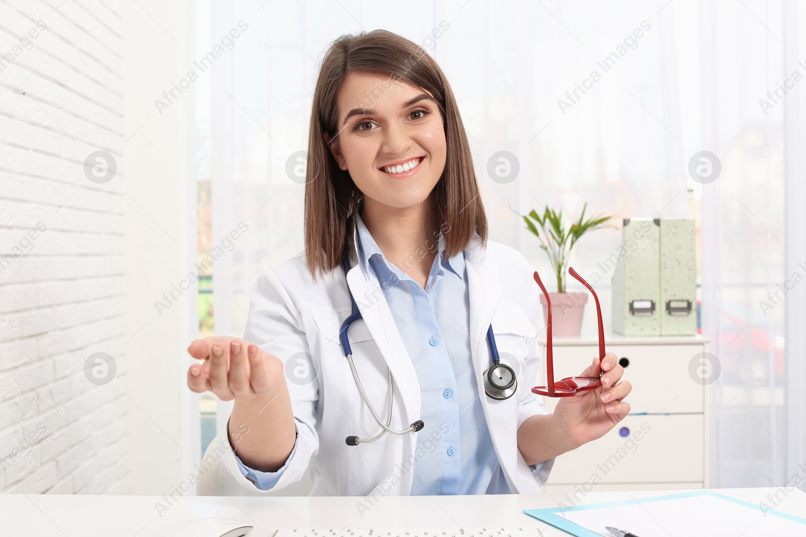 Photo of Pediatrician consulting patient using video chat in clinic, view from webcam