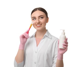 Cosmetologist with silicone brush and cosmetic product on white background