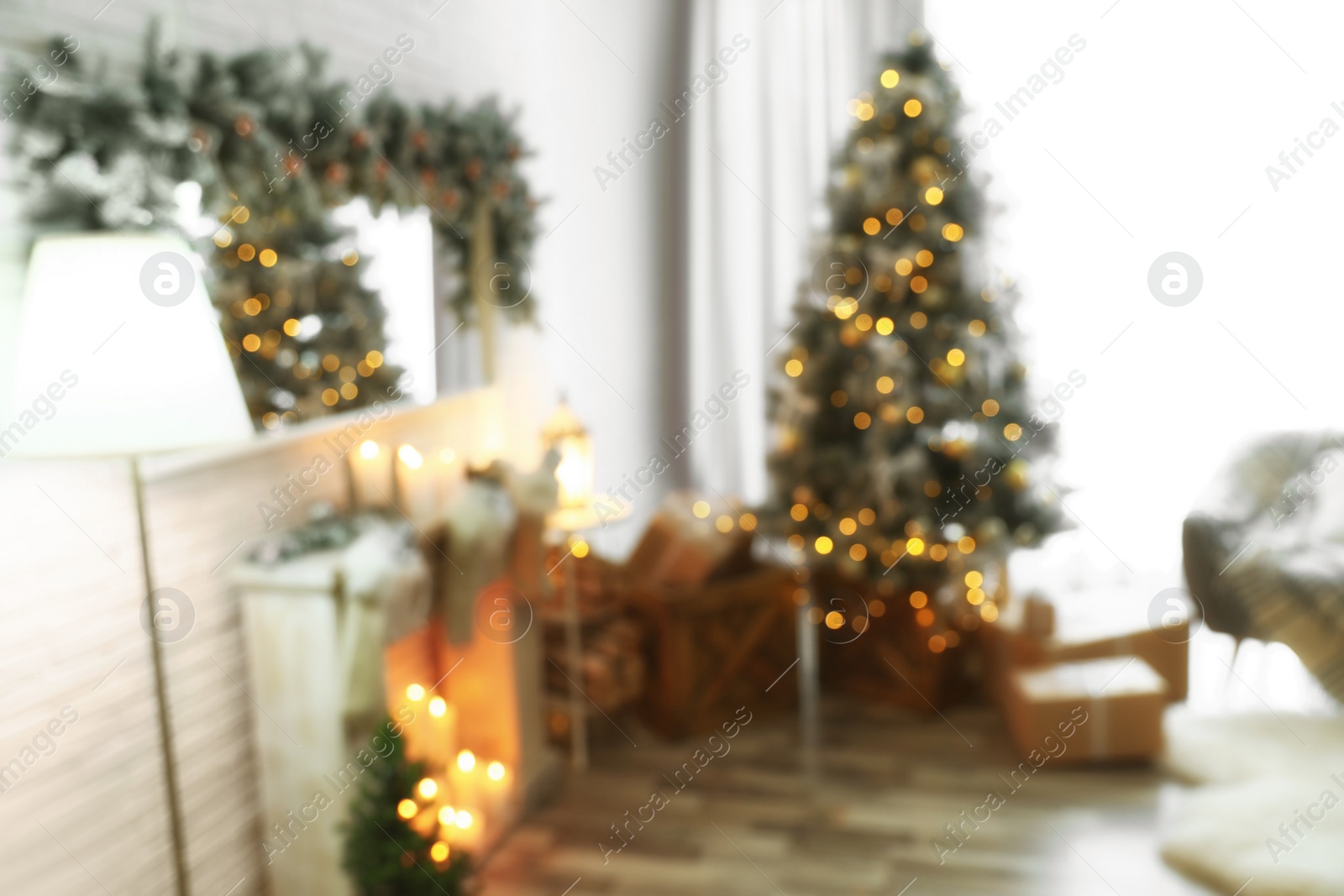 Photo of Blurred view of beautiful Christmas tree in living room interior