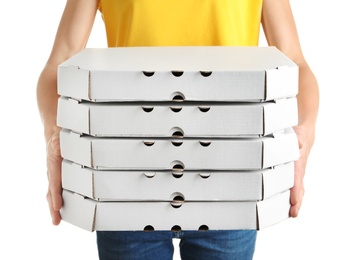 Woman holding cardboard pizza boxes on white background