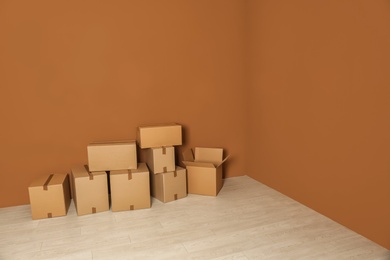 Photo of Cardboard boxes on floor indoors